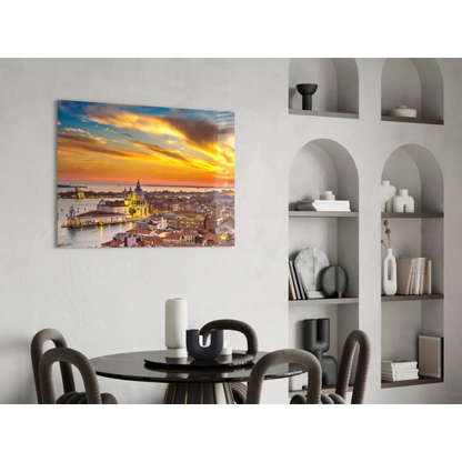 Vibrant sunset glass wall art with golden hues over water and city lights