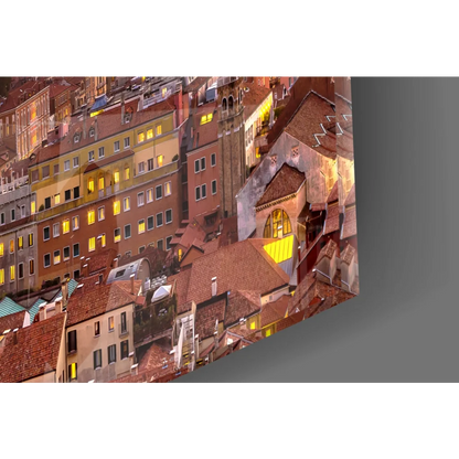 Cozy European cityscape glass wall art print in frame at dusk