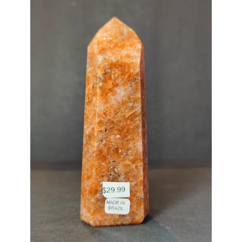 Sunstone polished obelisk tower sculpture featuring a polished orange citrine crystal point with natural mineral inclusions