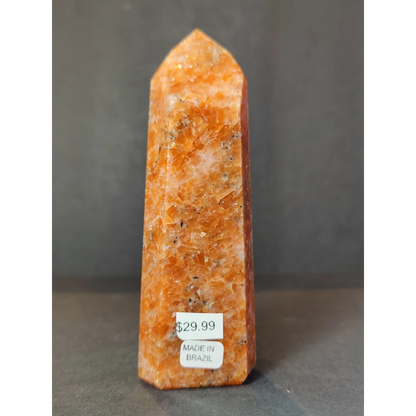 Sunstone polished obelisk tower sculpture featuring a polished orange citrine crystal point with natural mineral inclusions