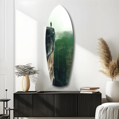 Oval surfboard tempered glass art of misty cliffside with lone figure, size comparison