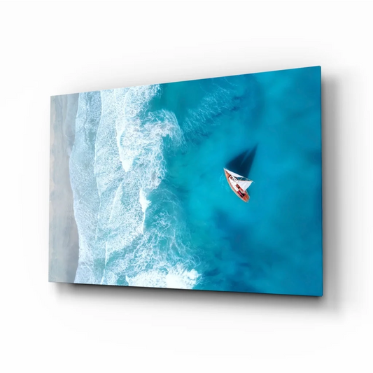 Aerial view of sailboat gliding on turquoise ocean wall art print