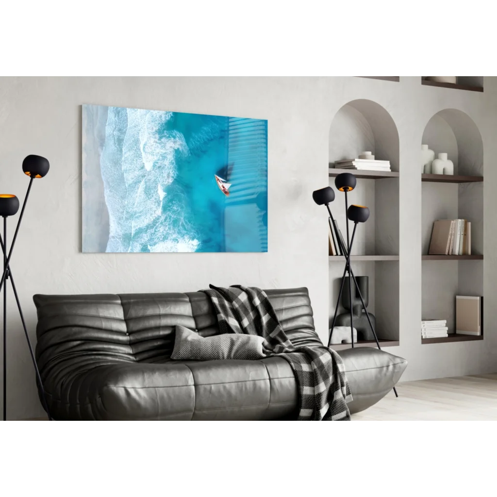 Modern black leather sofa with tufted details and plaid throw, under Surfer Ocean Wave wall art