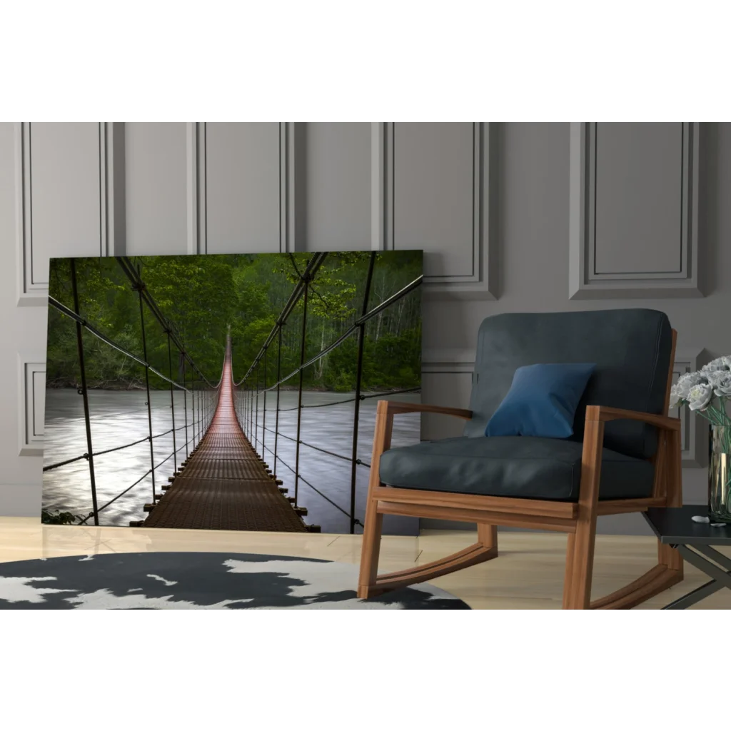 Dark blue rocking chair with wooden frame under suspended bridge wall art