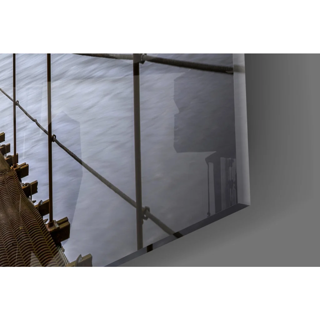 Sleek glass wall art of suspended bridge with lush forest views