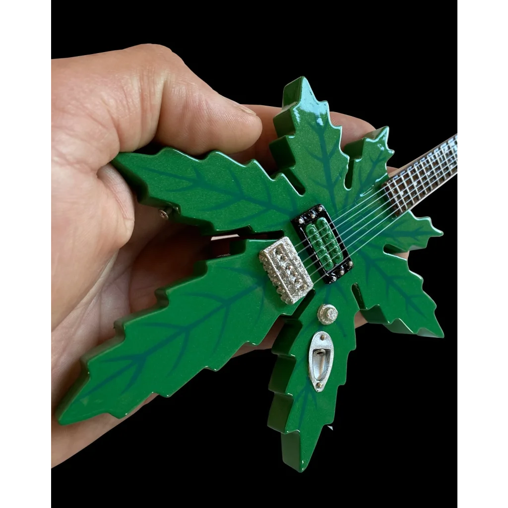 Green leaf Axe Heaven guitar model with stand