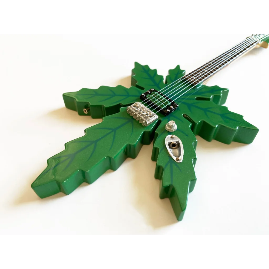 Green leaf Axe Heaven® miniature guitar model with stand