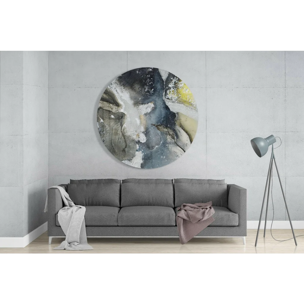 Swirling abstract tempered glass art circle on concrete wall