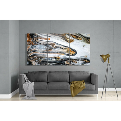 Swirling gold black white glass wall art triptych with abstract patterns