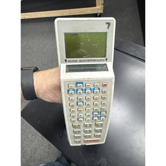 Symbol barcode scanner with beige handheld calculator keyboard and greenish screen