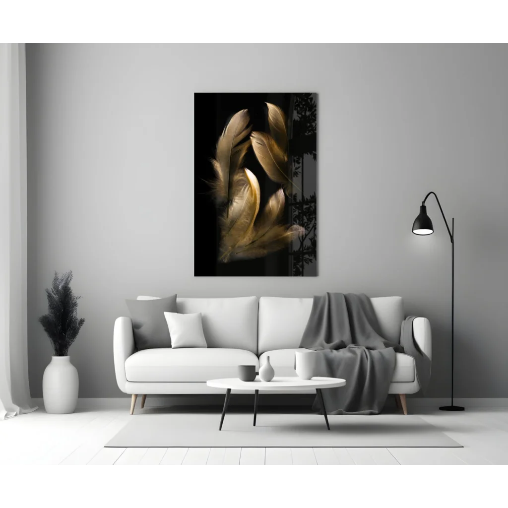 Modern black-and-gold glass wall art above white sofa on gray wall