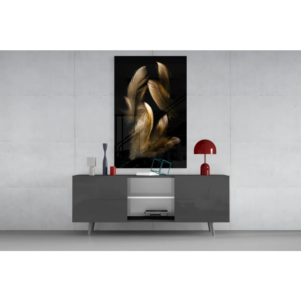 Stunning black-and-gold glass wall art feather above gray console