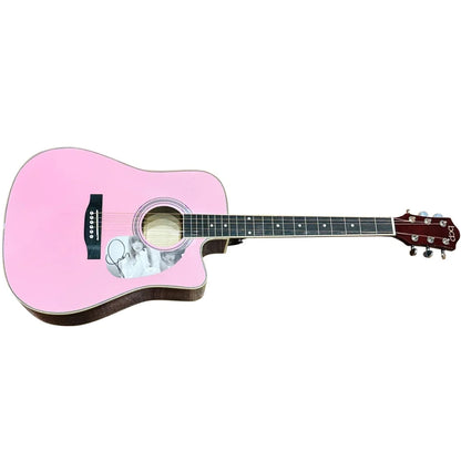 Taylor Swift pink acoustic guitar with black pickguard and signed photo