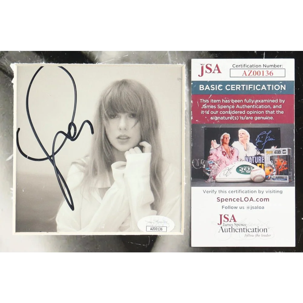 Signed Taylor Swift Folklore CD with JSA authentication in Taylor Swift Poets Department display