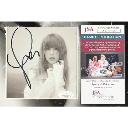 Signed Taylor Swift Folklore CD with JSA authentication in Taylor Swift Poets Department display
