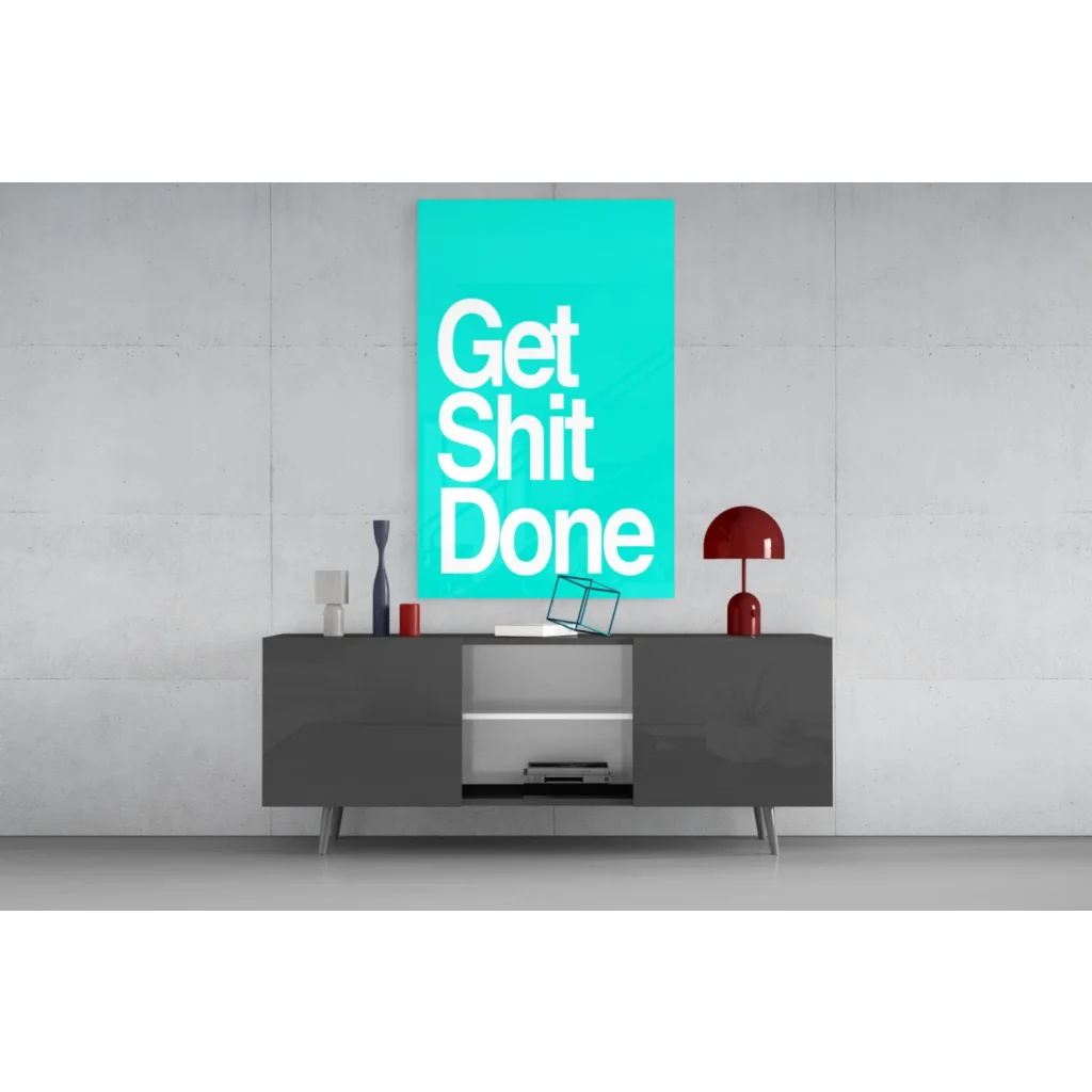 Teal Get Shit Done glass wall art with gray sideboard and red accents