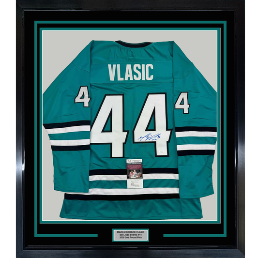 Framed teal San Jose Sharks jersey number 44 with "VLASIC" nameplate, signed, displayed flat against white backing with authentication certificate visible.