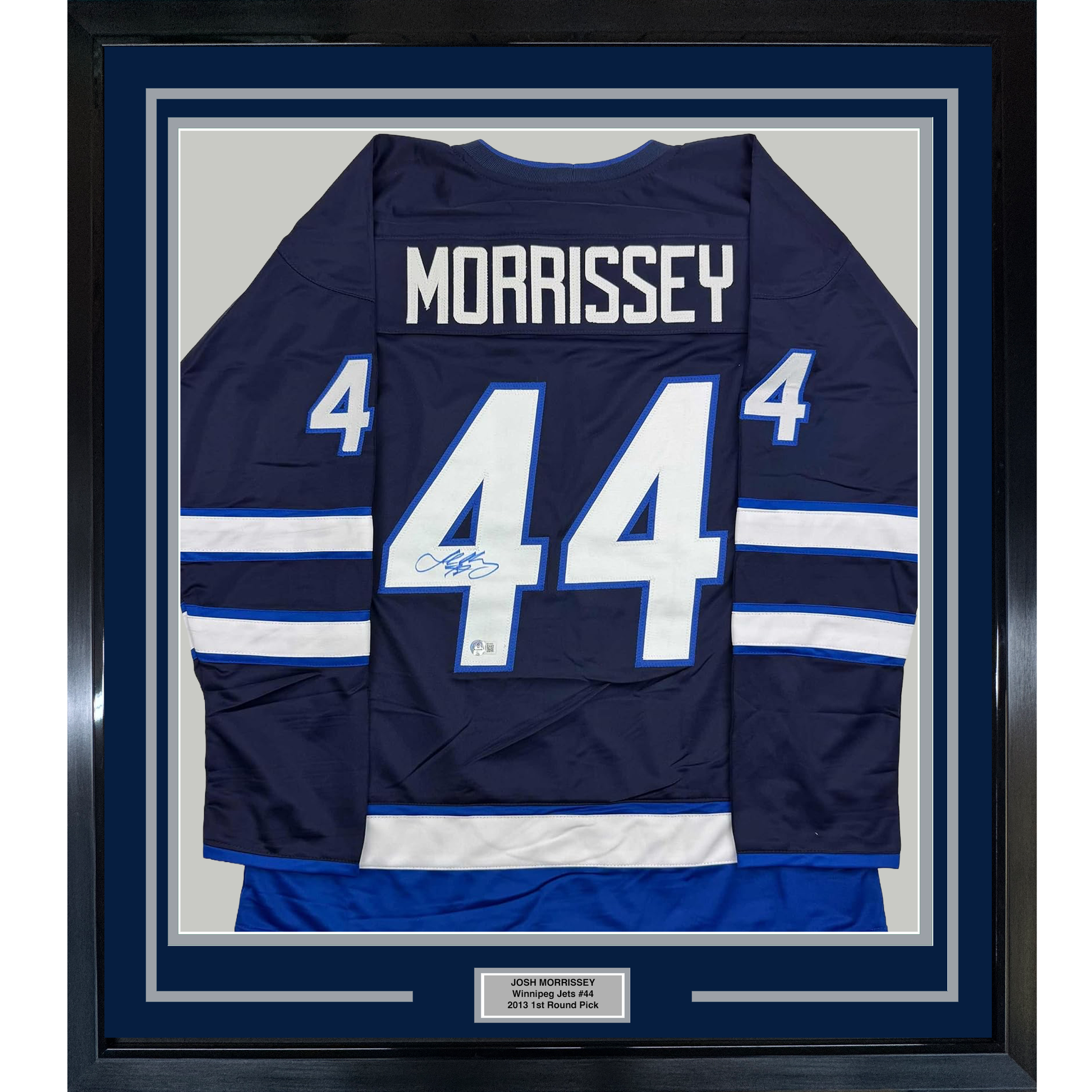 Framed navy Winnipeg Jets hockey jersey #44 with "MORRISSEY" nameplate, white and blue striping, displayed front-facing with authenticity plaque below.