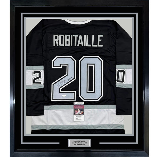Framed black Los Angeles Kings hockey jersey #20 with "ROBITAILLE" across shoulders and signed number, displaying JSA authentication certificate below.