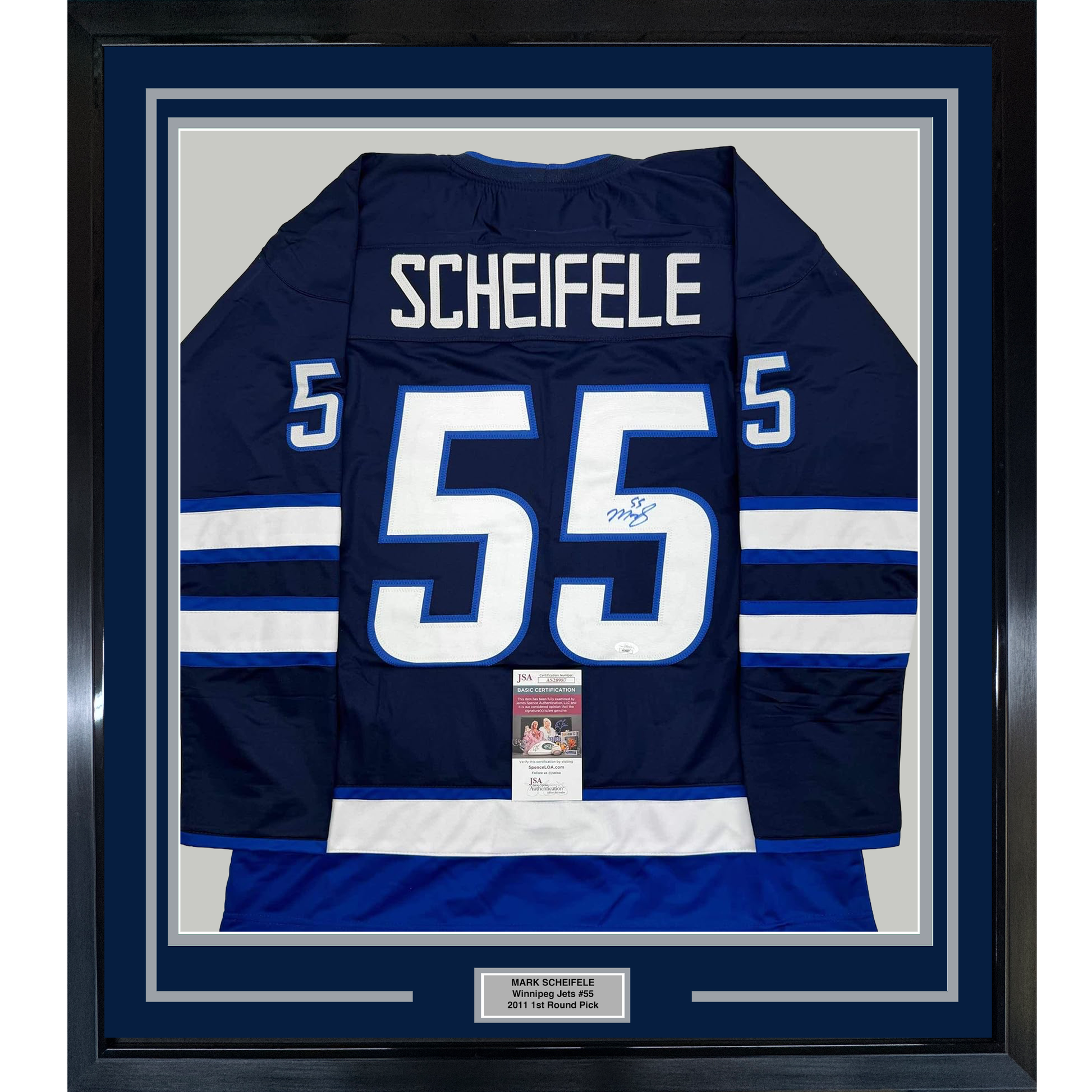 Navy blue Winnipeg Jets #55 hockey jersey with white and blue striping, displaying "SCHEIFELE" nameplate, framed with JSA authentication certificate visible at center bottom.