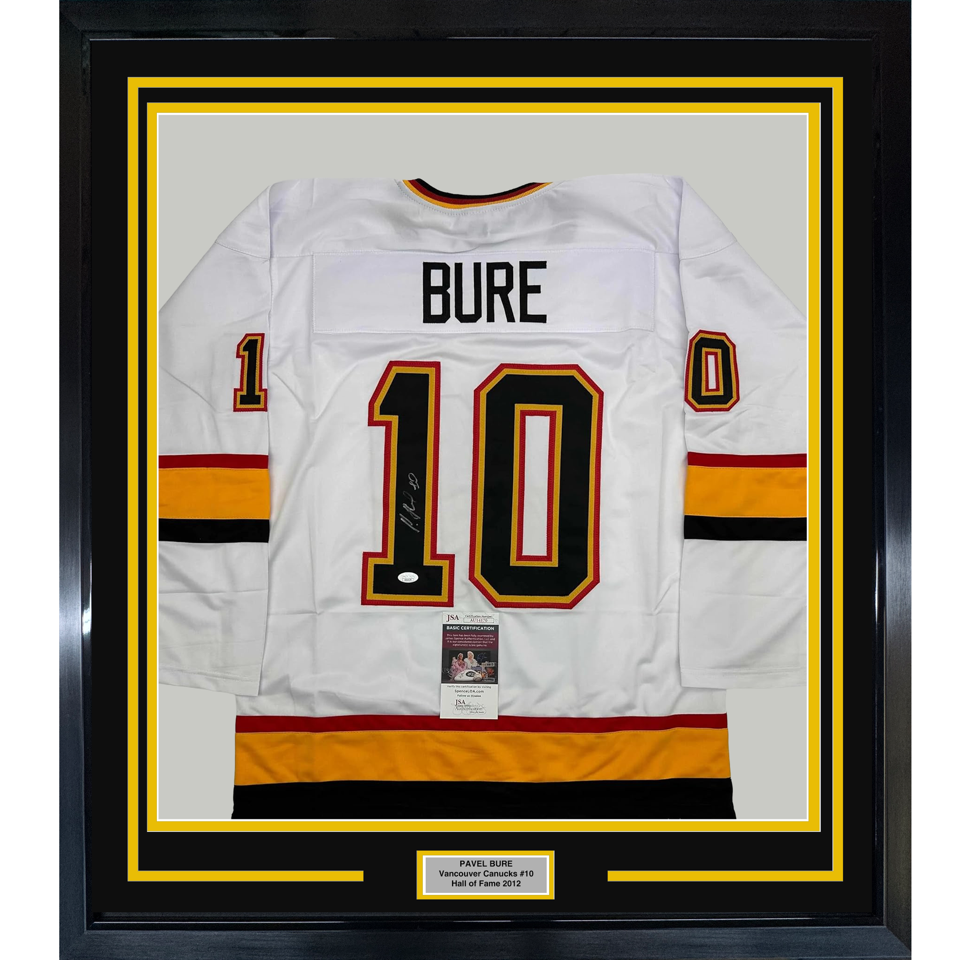 Framed white Vancouver Canucks hockey jersey number 10 with "BURE" nameplate and signature, displayed front-facing with yellow and black matting.