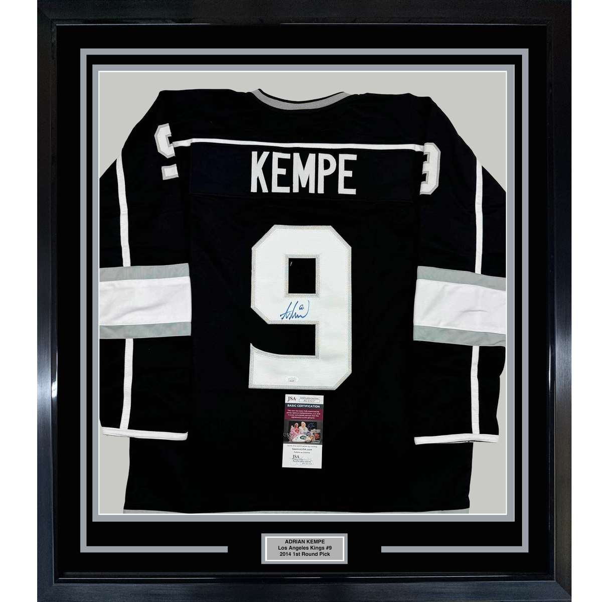 Black Los Angeles Kings jersey number 9 signed by Adrian Kempe, displayed framed with white matting and JSA authentication certificate.