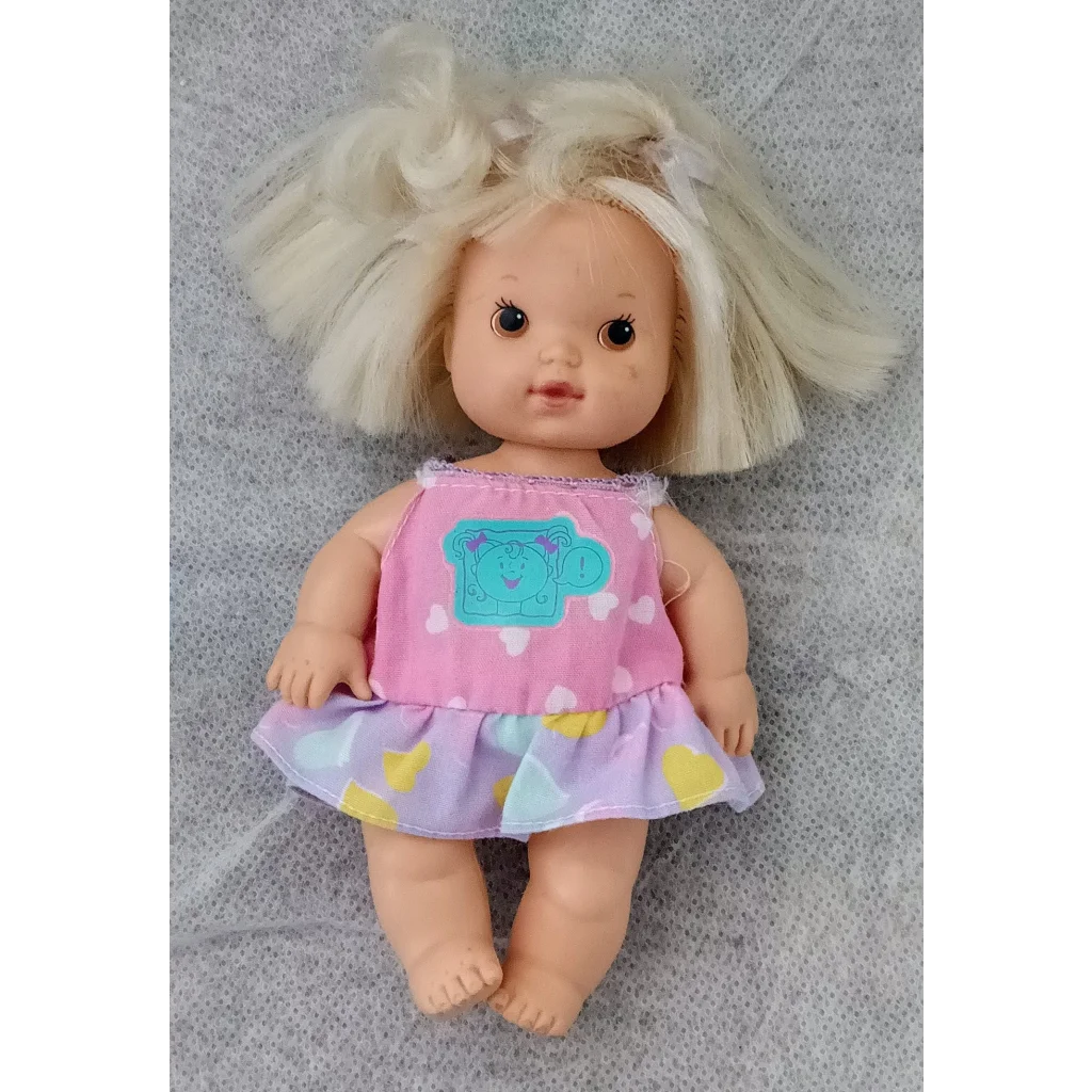 Vintage 1990 Cuddly Carly tot doll with blonde hair and pink heart dress