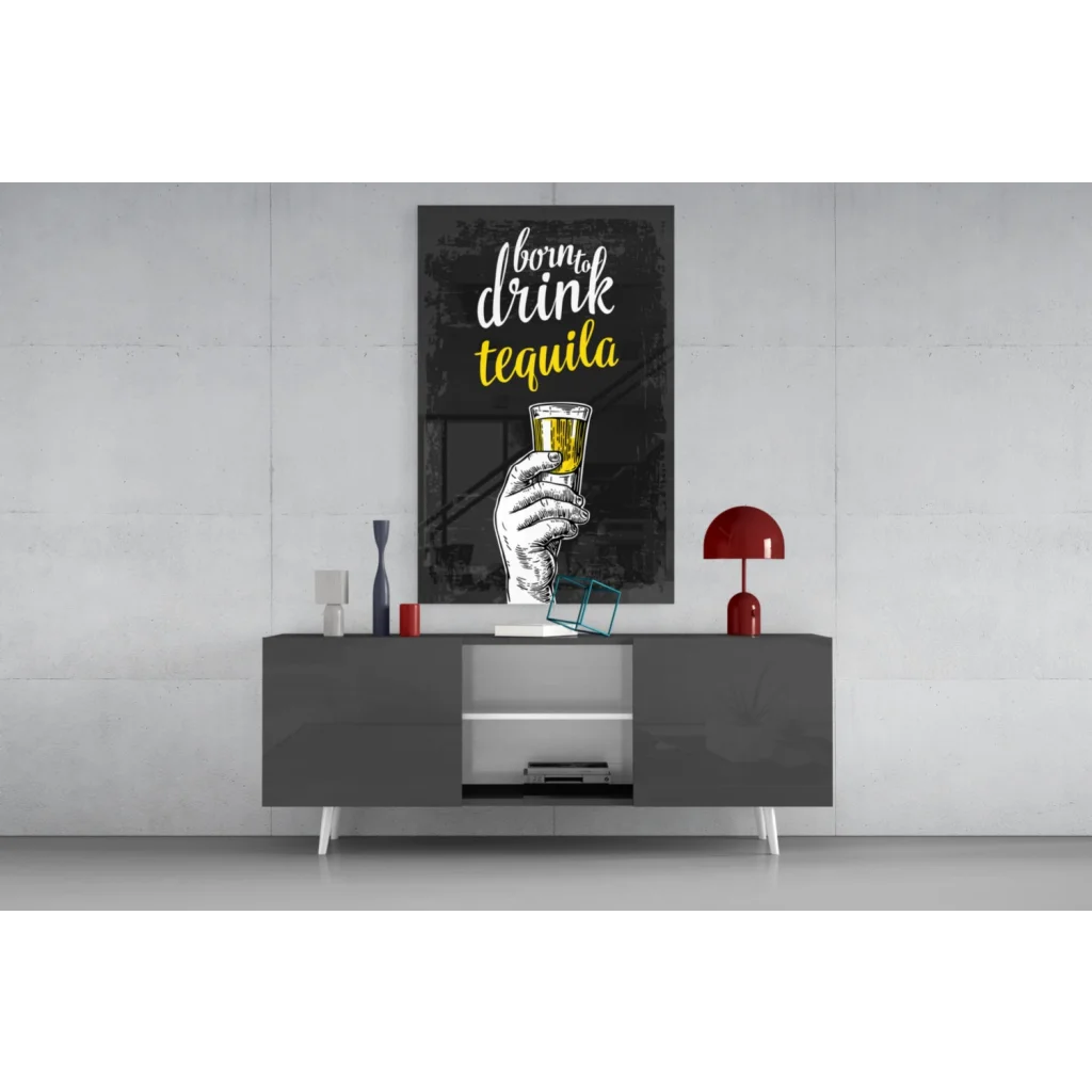 Black and yellow born to drink tequila glass wall art with hand holding golden liquid