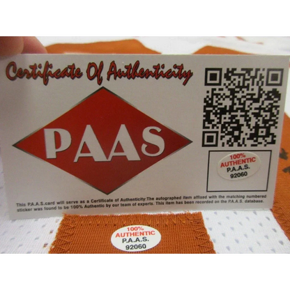 White card with orange diamond logo and QR code certifying Texas Longhorns signed autographed football