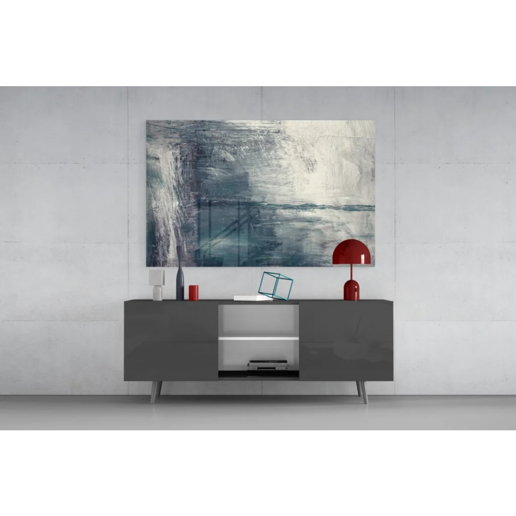 Modern gray sideboard with silver legs under textured blue gray abstract wall art