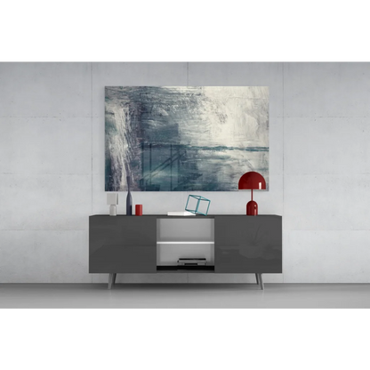 Modern gray sideboard with silver legs under textured blue gray abstract wall art