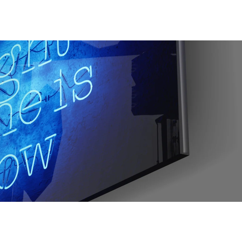 Blue neon glass wall art sign: the is now on dark textured backdrop