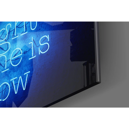 Blue neon glass wall art sign: the is now on dark textured backdrop