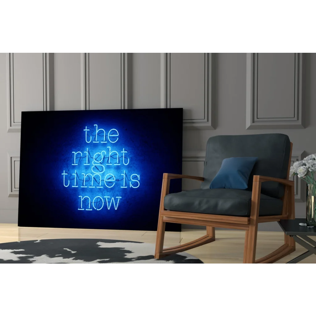 Blue neon glass wall art sign The right time is now glowing on dark background