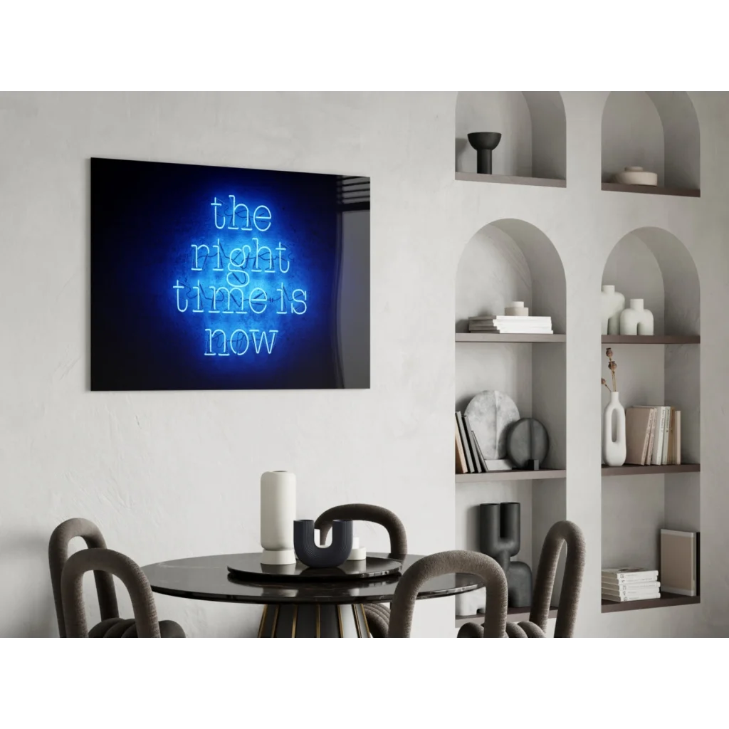 Blue neon glass wall art with The Right Time Is Now text on dark background