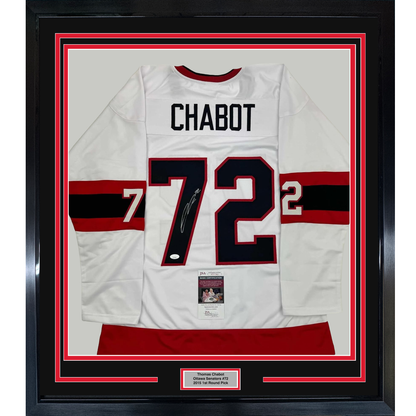 Framed white Ottawa Senators hockey jersey with "CHABOT" and number 72, signed, displayed front-facing with red and black striping and JSA authentication certificate visible.