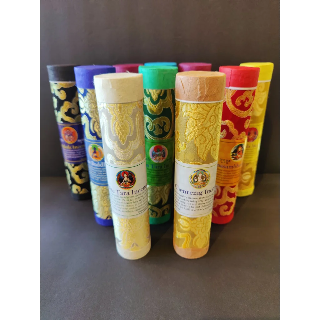Tibetan handmade incense sticks in ornate colorful tubes
