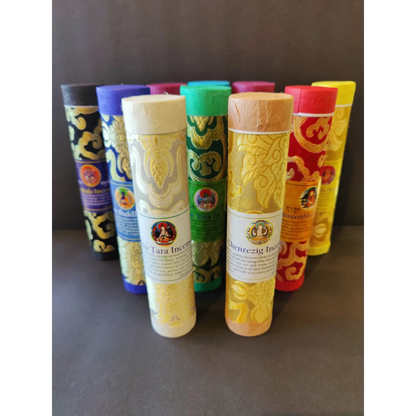 Tibetan handmade incense sticks in ornate colorful tubes