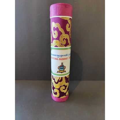 Tibetan handmade incense in magenta gold fabric with Buddhist icons