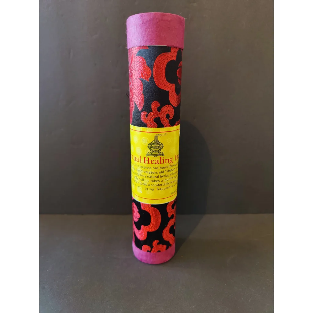 Tibetan handmade incense tube with pink ends, black fabric and red floral patterns