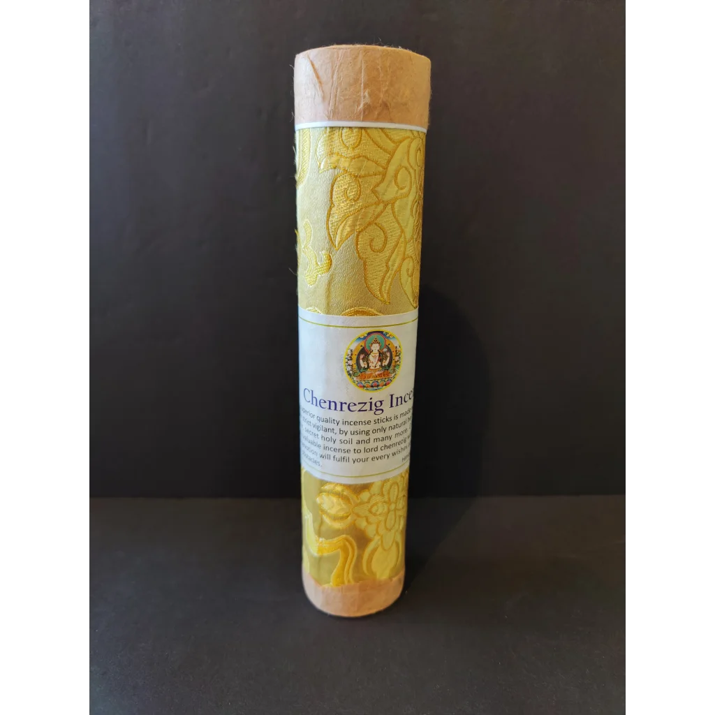 Tibetan handmade incense: golden-yellow Chenrezig sticks in ornate paper