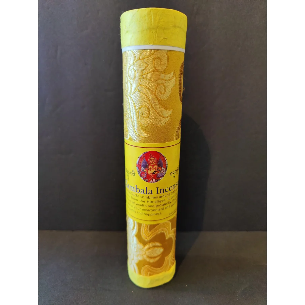 Vibrant Tibetan handmade incense: yellow pack with gold patterns, red deity emblem