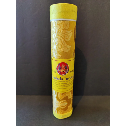 Vibrant Tibetan handmade incense: yellow pack with gold patterns, red deity emblem