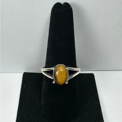 Silver tiger eye ring with oval stone in sleek open-backed band