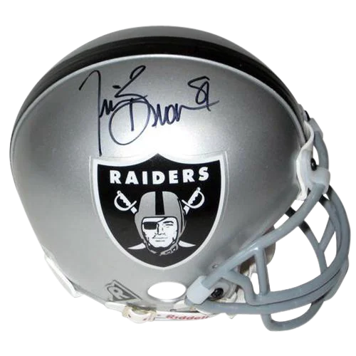 Silver Oakland Raiders mini helmet with black and white logo signed by Tim Brown autographed for collectors
