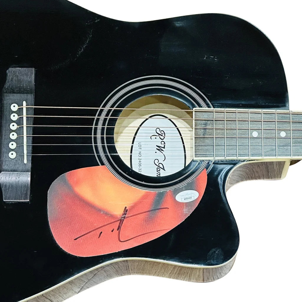 Tim McGraw black acoustic guitar with flame design on sound hole