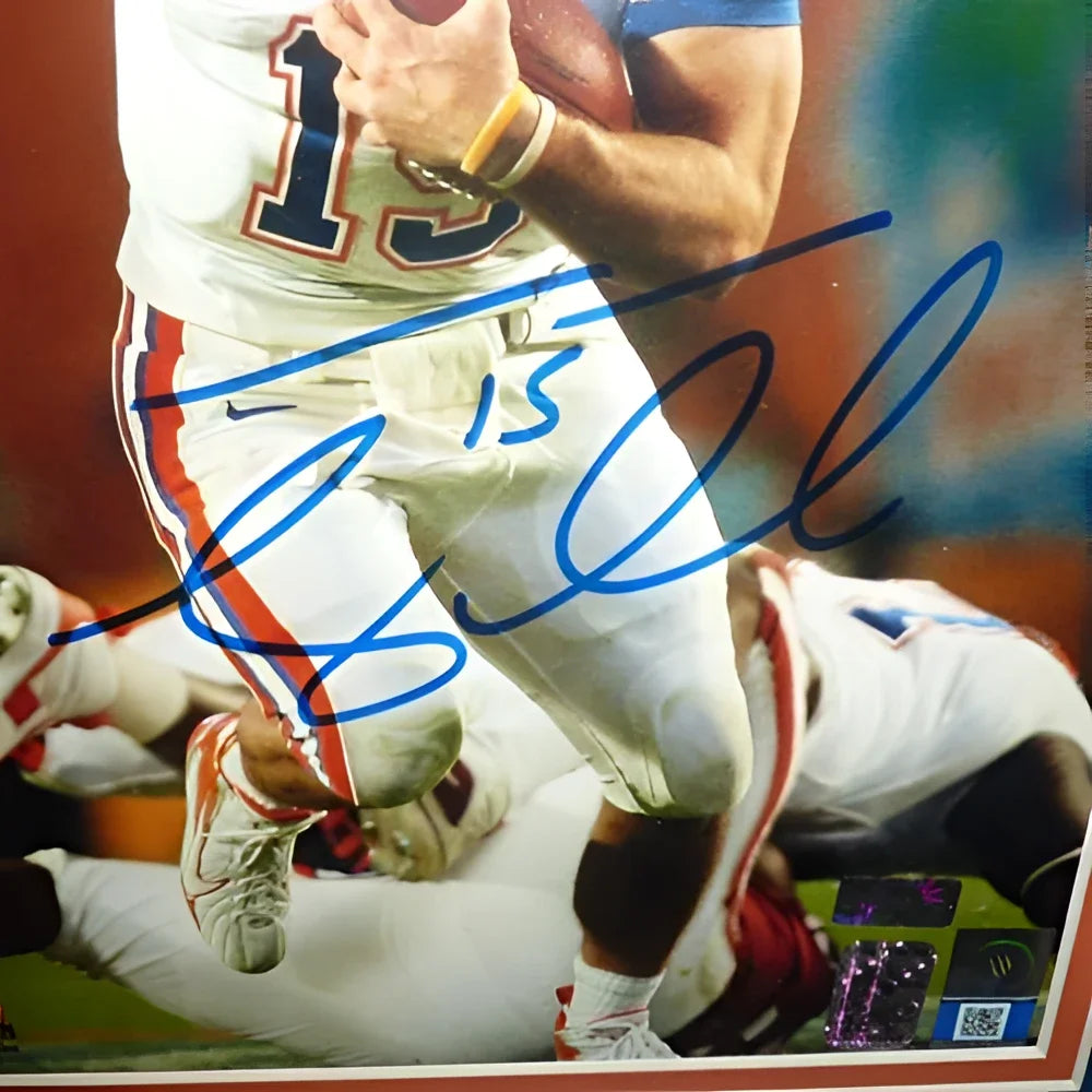 Autographed Tim Tebow framed 8x10 photo in orange and white Florida Gators uniform holding a football from private signing