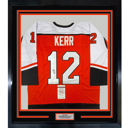 Framed red Philadelphia Flyers #12 jersey signed by Tim Kerr, displayed front-facing with white and black trim and JSA authentication certificate visible.