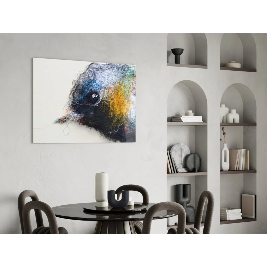 Abstract glass wall art of textured bird head in blues, yellows, blacks