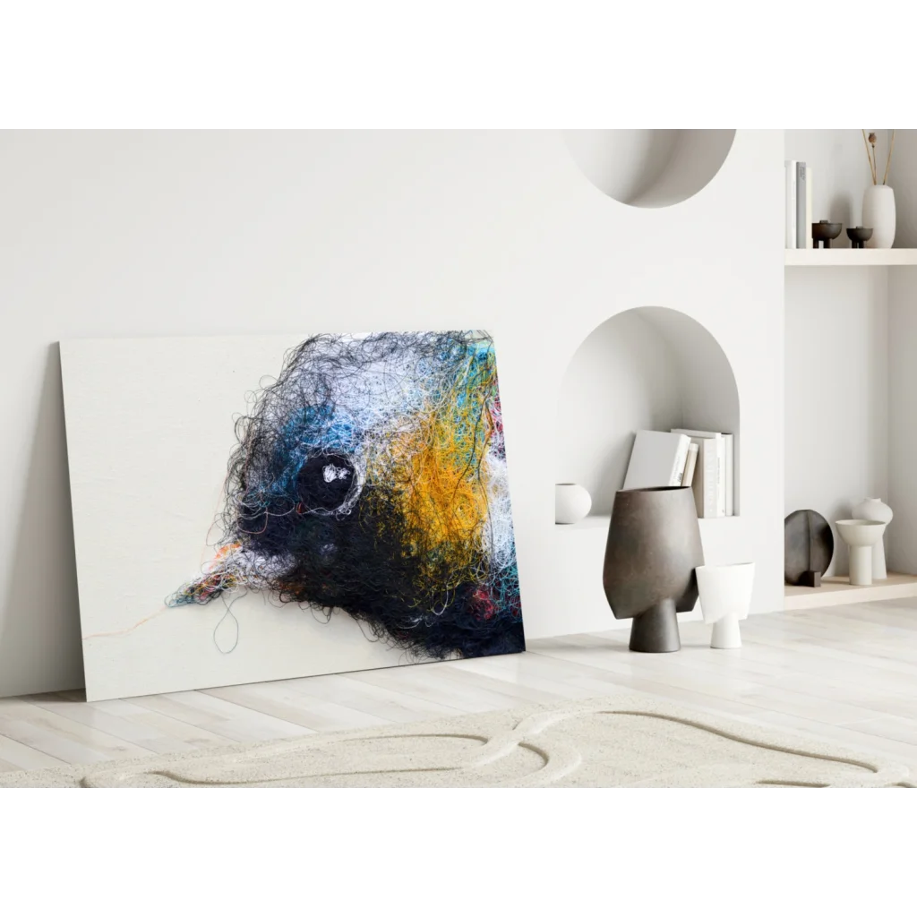 Vibrant abstract glass wall art of birds head in black, blue, yellow threads